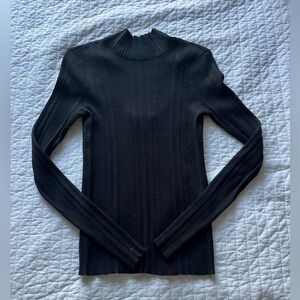 black turtle neck ribbed long sleve with fun cut out in the back